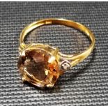 Modern yellow metal topaz and diamond chip dress ring, stamped 375, weight 1.8g approx.
