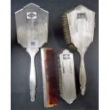 Art Deco silver four-piece engine turned dressing table set including a handheld mirror, hair brush,