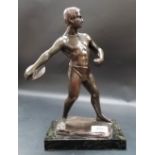 After H. Keck, a patinated bronze of a discus thrower, signed, black rectangular marble base, height