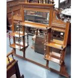 Victorian walnut bevel edged oval over mantel mirror with open shelves and seven bevel edged plates,