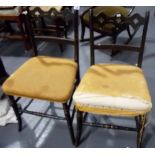 Pair of Regency ebonised and gilt painted bedroom chairs with stuff-over seats