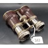 Pair of early 20th Century leather covered and silver plated binoculars.