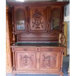 19th Century French walnut Court cupboard, the top with a central cupboard with carved urn flanked