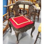 Mahogany foliate carved elbow corner chair with drop-in upholstered seat and on three cabriole legs