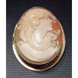 Modern 9ct gold mounted oval shell cameo carved with a lady in profile, height 4.5cm.