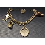 9ct gold charm bracelet with four charms and a padlock, weight overall 40.3g approx.