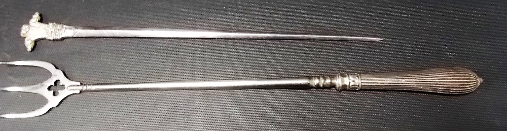 Victorian silver handled toasting fork together with a silver plated skewer with fleur-de-lys finial