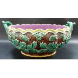 Majolica twin handled oval jardinière, the sides moulded with acorns and leaves, width 16.5 in.
