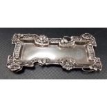 Edwardian Art Nouveau silver pin tray the shaped edge decorated with stylised flowers, Maker K &