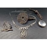 Silver and white metal jewellery including a filigree flower holder brooch, a plain silver locket, a