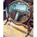 Oval mahogany swing toilet mirror.