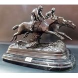 Bronze group depicting two racing jockeys and horses upon a naturalistic base and grey veined marble