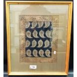 Eastern silk embroidered panel stitched with full rows of four emblems on a blue ground and with a