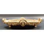 19th Century brass oval pen tray cast with rams and heads masks, flowers upon four scroll feet,