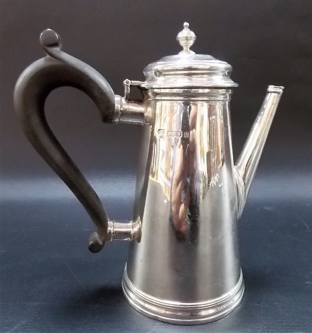 George V silver coffee pot of plain cylindrical tapered form and with ebony handle, maker H & Co