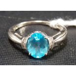 Modern 9ct white gold blue stone and diamond chip ring, weight 2.9g approx.