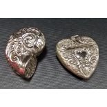 White metal snuff box in the form of a shell, foliate embossed; together with a white metal heart