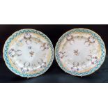 Pair of early 19th Century Coalport Feltspar porcelain plates painted with floral garlands and