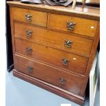 Early 20th Century Arts and Crafts oak chest of two short over three long graduated drawers, the