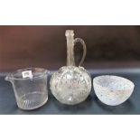 A Venetian clear glass claret jug, the ovoid body wheel engraved with fruiting vine and birds