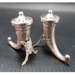 Pair of Norwegian white metal pepper shakers in the forms of cattle horns with Celtic Knot