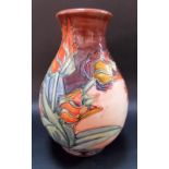 Modern Moorcroft ovoid vase, tube-line decorated with stylised flowers upon a burgundy and pink