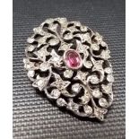 Silver gem set brooch with oval pink stone surrounded by clear stones, weight 5.8g approx.