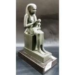 A modern composition bronzed seated Egyptian figure upon black rectangular marble base, height 8.