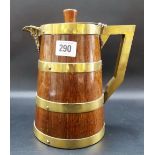 Oak brass coopered hinge lidded wine jug with Bacchus flask spout, height 9in