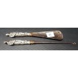 Victorian silver filled button hook and shoe horn, the embossed handles modelled as a classically