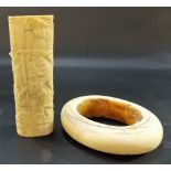 Antique ivory bangle; together with a Japanese bone carved dagger handle, carved with Samurai (2).