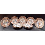 Set of eleven Japanese Imari plates foliate decorated and with panels of birds & underglaze blue