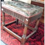 Oak replica rectangular stool, the upholstered top over a carved frieze and on turned supports