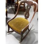 Victorian mahogany rocker with vase splat over a stuff-over seat