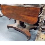 19th Century rosewood pedestal Pembroke table upon quadraform plateau with bun feet and castors.