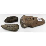 Three stone axes, the largest catalogued as Stone Age South Sea Islands, length 7.25in, another