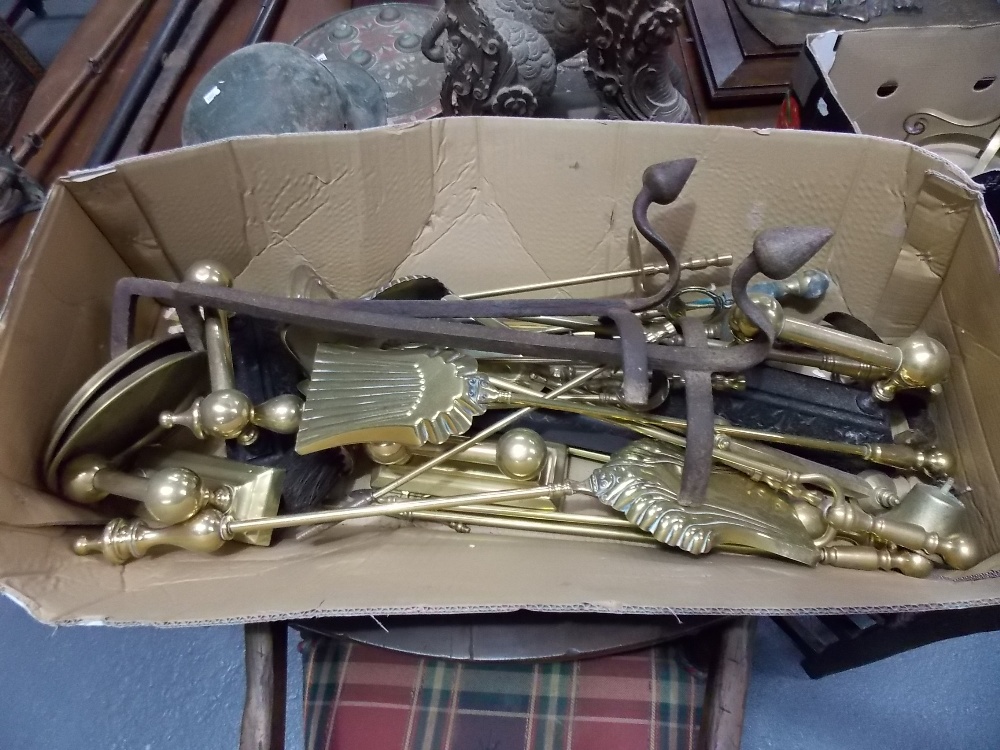 Box of Victorian brass fire implements together with a pair of wrought iron fire dogs