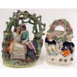 Victorian Staffordshire pottery group modelled as lovers under a tree arch, height 9.5in; together