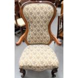 Victorian rosewood upholstered nursing elbow chair.
