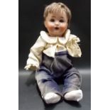 John Bing bisque porcelain head doll, height 15.5in (one arm missing).