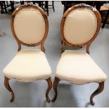 Pair of Victorian rosewood balloon back salon chairs with cabriole legs.