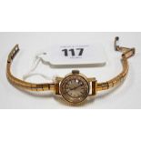 Omega 18ct gold cased ladies manual wind wristwatch, the cream dial with baton markers and signed