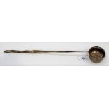 18th Century white metal toddy ladle with twisted handle, the plain oval bowl set with a Charles III