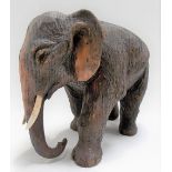 Carved wood and painted model of a standing elephant, width 6.25in.