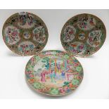 Pair of Cantonese famille rose plates decorated with four reserves of figures and birds amongst