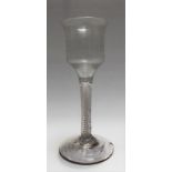 18th Century wine glass with multiple white opaque air twist stem, height 5.75in (chip to foot)