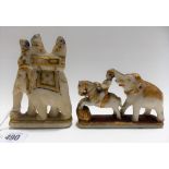 Two Indian carved marble groups one depicting figures on an elephant, the other with elephant and