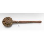 A Fijian Ula throwing club with natural ovoid head, the shaft with dot and zigzag carved decoration,