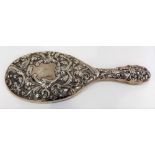 Victorian silver foliate scroll and mask embossed hand mirror, London 1900.