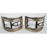 Pair of George III silver shoe buckles of curved rectangular form decorated with four flower heads